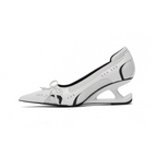 Vega • Décolleté metallico con tacco scultoreo e fiocco