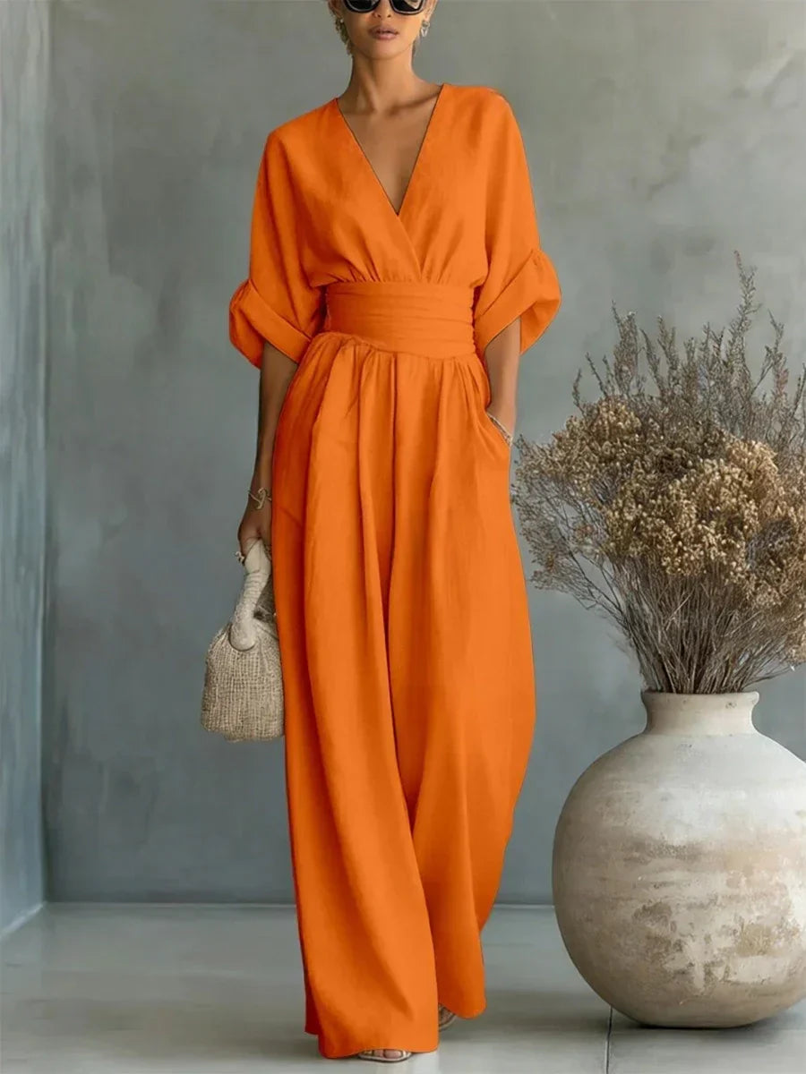 Mono elegante con escote en V y talle alto